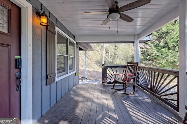 deck with ceiling fan and covered porch