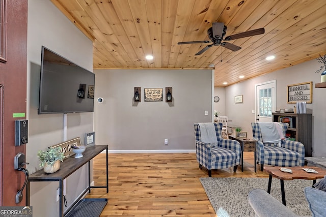 living area featuring wood ceiling, recessed lighting, light wood finished floors, ceiling fan, and baseboards