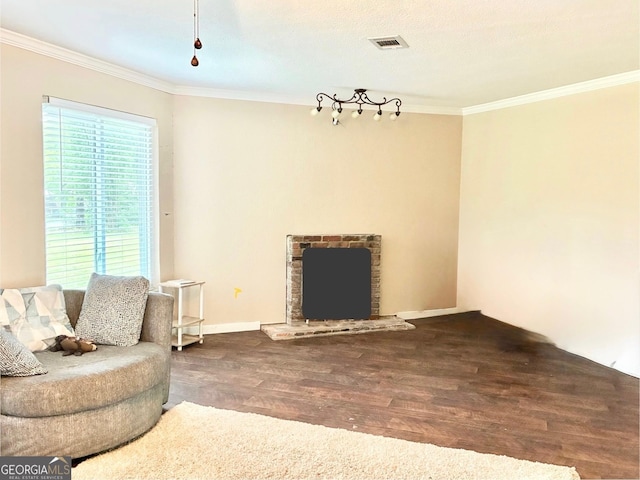 1002 Cherokee Cir, Waycross, GA 31501 - living area featuring wood finished floors, crown molding, a brick fireplace, and baseboards