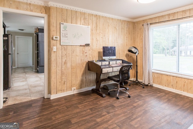 home office with wooden walls, baseboards, wood finished floors, and ornamental molding
