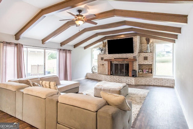 living area featuring a ceiling fan, a fireplace, wood finished floors, and baseboards