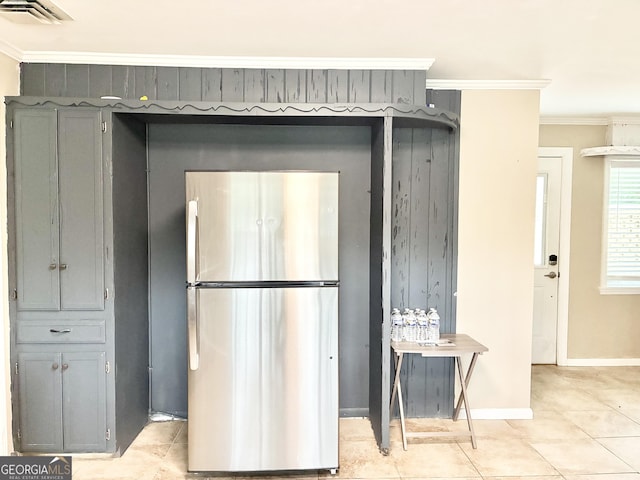 1002 Cherokee Cir, Waycross, GA 31501 - kitchen featuring freestanding refrigerator, crown molding, light tile patterned floors, baseboards, and gray cabinets
