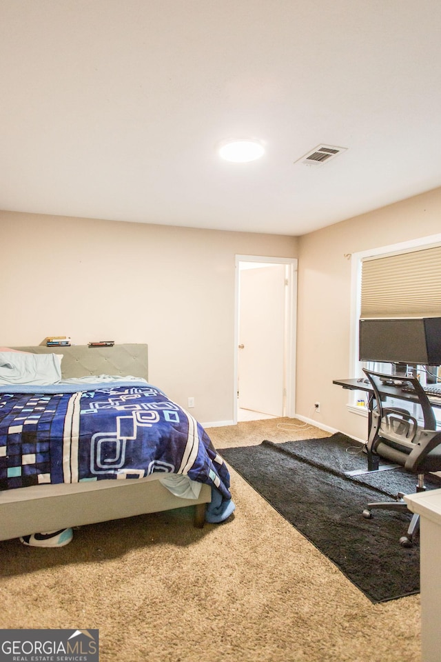 carpeted bedroom with baseboards