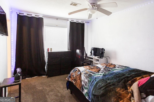 carpeted bedroom with ceiling fan