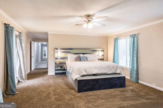 carpeted bedroom featuring crown molding, baseboards, ceiling fan, and a textured ceiling
