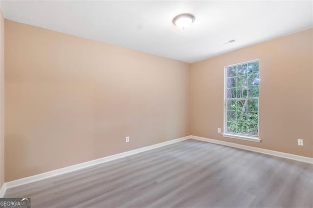 5805 Eagles Feather Ln, Riverdale, GA 30274 - empty room with wood finished floors and baseboards