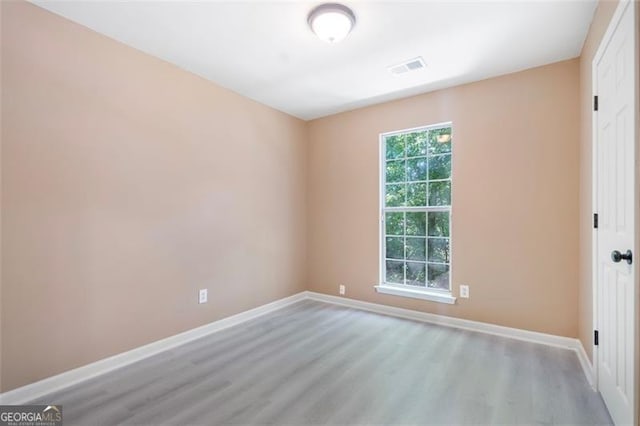 5805 Eagles Feather Ln, Riverdale, GA 30274 - empty room featuring wood finished floors and baseboards