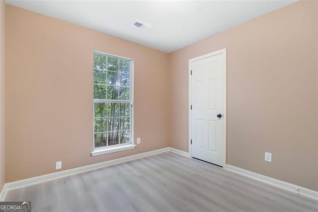5805 Eagles Feather Ln, Riverdale, GA 30274 - spare room with wood finished floors and baseboards