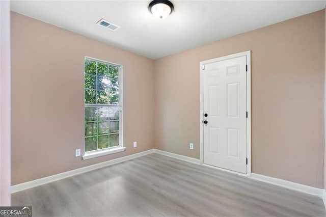 5805 Eagles Feather Ln, Riverdale, GA 30274 - empty room featuring light wood-style floors and baseboards