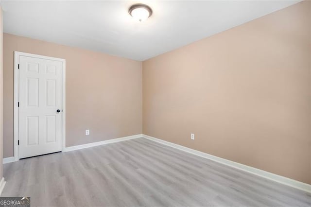 5805 Eagles Feather Ln, Riverdale, GA 30274 - spare room with light wood finished floors and baseboards