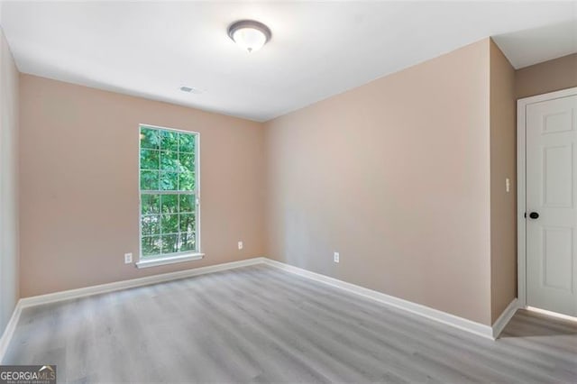 5805 Eagles Feather Ln, Riverdale, GA 30274 - unfurnished room with wood finished floors and baseboards