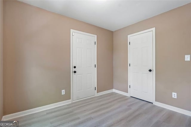 5805 Eagles Feather Ln, Riverdale, GA 30274 - spare room with light wood finished floors and baseboards