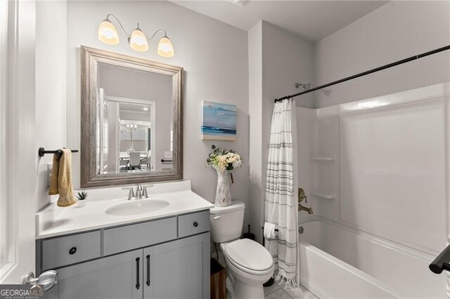 full bath featuring toilet, vanity, shower / bathtub combination with curtain, and tile patterned floors