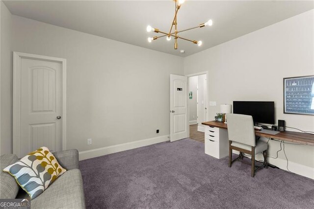 carpeted home office featuring a chandelier and baseboards
