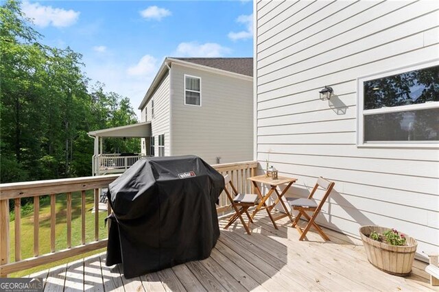 deck featuring a grill