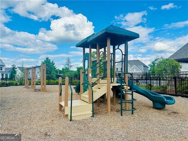 communal playground featuring fence