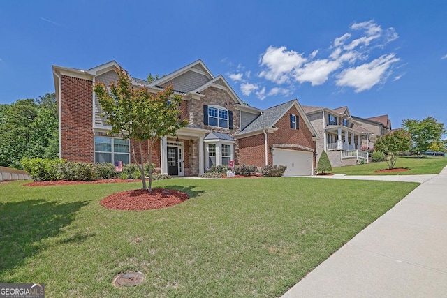 4100 Secret Shoals Way, Buford, GA 30518 - view of front of home with driveway, brick siding, a front yard, and stone siding