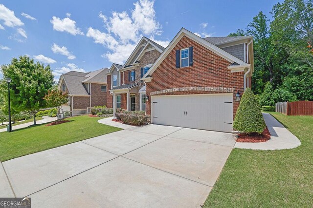 4100 Secret Shoals Way, Buford, GA 30518 - view of front of home featuring concrete driveway, brick siding, and an attached garage