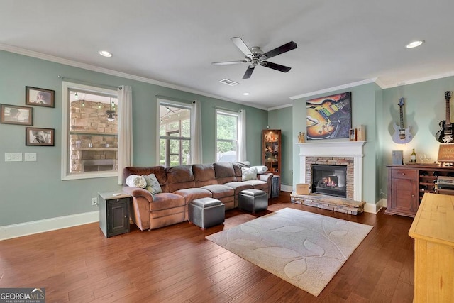 4100 Secret Shoals Way, Buford, GA 30518 - living area with a ceiling fan, a stone fireplace, dark wood finished floors, ornamental molding, and baseboards