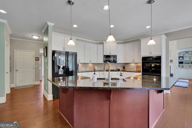 4100 Secret Shoals Way, Buford, GA 30518 - kitchen featuring black appliances, ornamental molding, backsplash, dark wood-style floors, and a breakfast bar area