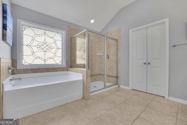 4100 Secret Shoals Way, Buford, GA 30518 - bathroom with a garden tub, a stall shower, vaulted ceiling, and tile patterned flooring
