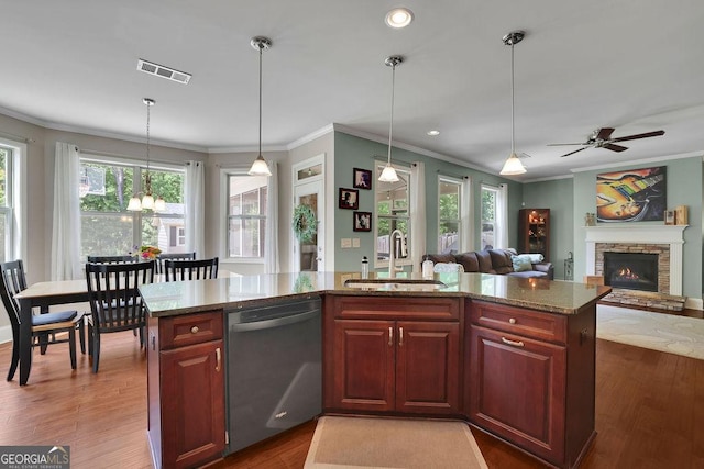 4100 Secret Shoals Way, Buford, GA 30518 - kitchen with stainless steel dishwasher, a sink, ornamental molding, stone counters, and pendant lighting