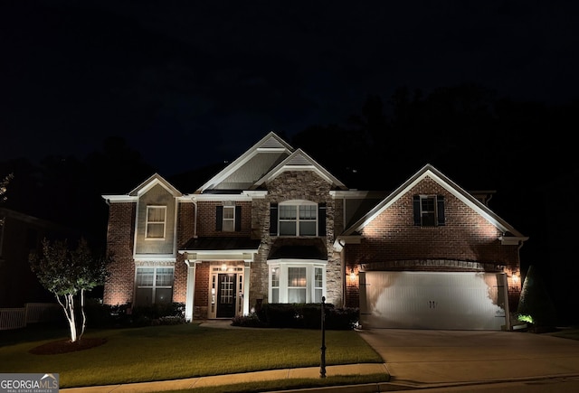 4100 Secret Shoals Way, Buford, GA 30518 - view of front of property with stone siding, driveway, a lawn, brick siding, and a garage