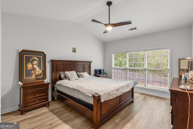 bedroom with light wood-type flooring, lofted ceiling, and ceiling fan