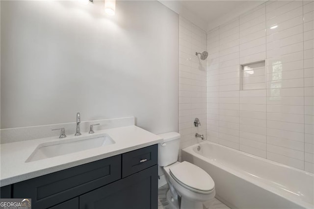 bathroom with toilet, vanity, and  shower combination
