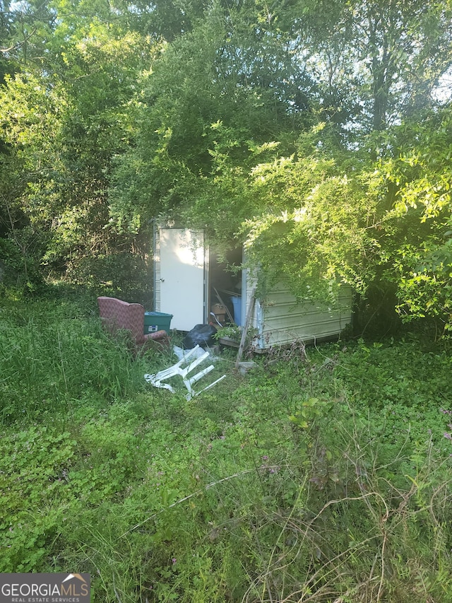 3491 Bond St W, Macon, GA 31204 - view of yard with an outdoor structure and a storage shed