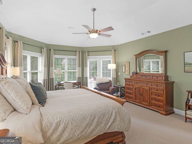 219 Eagles Landing Way, Mcdonough, GA 30253 - carpeted bedroom with multiple windows and ceiling fan