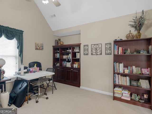 office space with lofted ceiling, light colored carpet, ceiling fan, and baseboards
