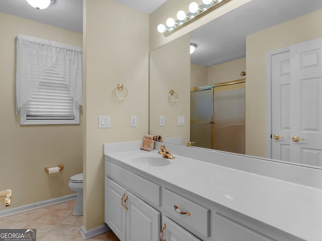 219 Eagles Landing Way, Mcdonough, GA 30253 - bathroom featuring a shower with shower door, vanity, tile patterned flooring, and a textured ceiling