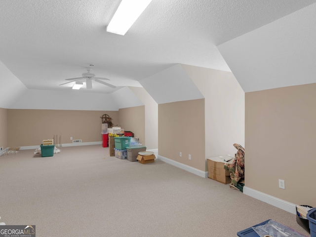 219 Eagles Landing Way, Mcdonough, GA 30253 - game room with vaulted ceiling, carpet floors, and a textured ceiling
