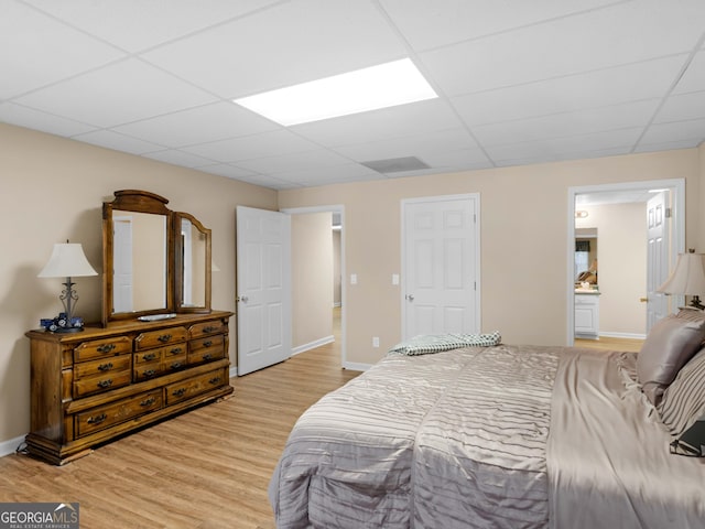 219 Eagles Landing Way, Mcdonough, GA 30253 - bedroom with a paneled ceiling, light wood-style flooring, and ensuite bath