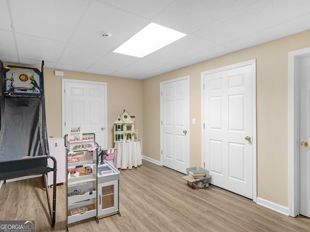 219 Eagles Landing Way, Mcdonough, GA 30253 - bedroom featuring light wood finished floors and a drop ceiling