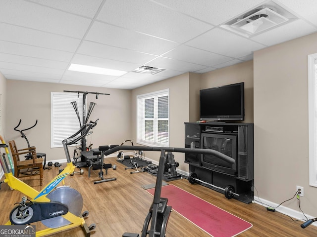 219 Eagles Landing Way, Mcdonough, GA 30253 - workout room with wood finished floors and a paneled ceiling