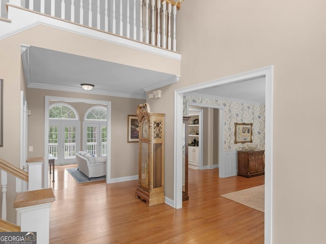 219 Eagles Landing Way, Mcdonough, GA 30253 - hall featuring crown molding, light wood-style floors, stairway, and wallpapered walls