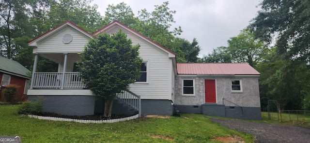 110 Forrest Ave, Jackson, GA 30233 - view of front facade featuring crawl space, entry steps, a front yard, stairway, and metal roof