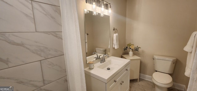 110 Forrest Ave, Jackson, GA 30233 - bathroom with toilet, marble look tiles, baseboards, and vanity
