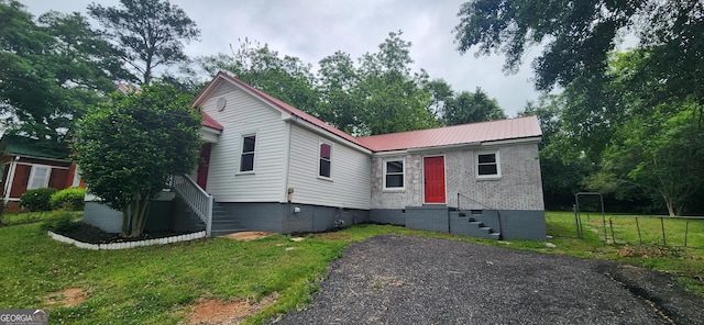 110 Forrest Ave, Jackson, GA 30233 - view of front of home with crawl space, metal roof, brick siding, and stairs