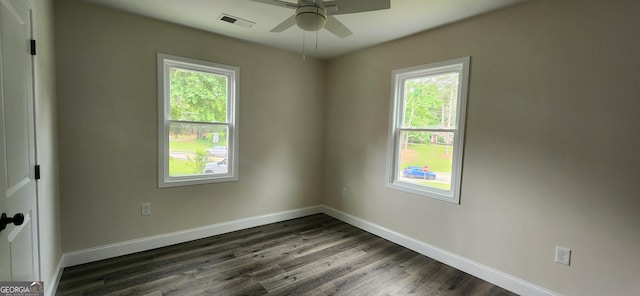 110 Forrest Ave, Jackson, GA 30233 - empty room with plenty of natural light, ceiling fan, dark wood finished floors, and baseboards
