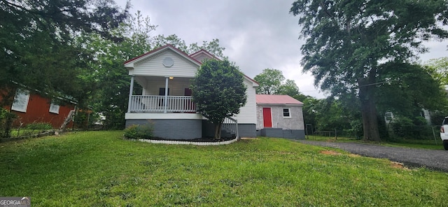 110 Forrest Ave, Jackson, GA 30233 - view of front of house featuring a front lawn and a porch