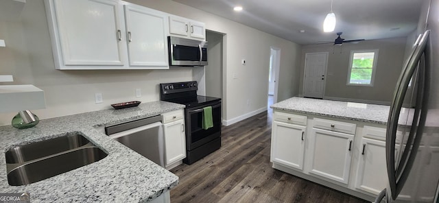 110 Forrest Ave, Jackson, GA 30233 - kitchen featuring appliances with stainless steel finishes, dark wood-type flooring, white cabinetry, a ceiling fan, and a sink