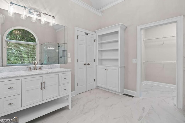 full bath featuring marble look tiles, a shower stall, ornamental molding, vanity, and baseboards