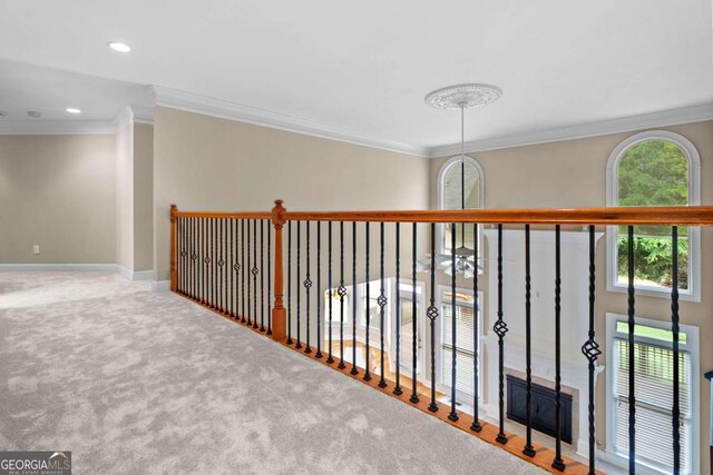 hall featuring carpet floors, ornamental molding, recessed lighting, and baseboards