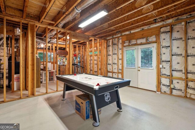 rec room featuring concrete floors