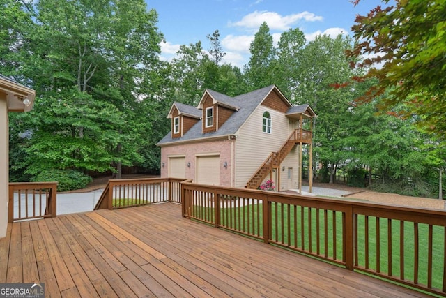 wooden terrace featuring stairs, a garage, and view of scattered trees
