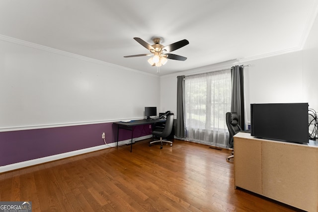 office space featuring wood finished floors, ceiling fan, crown molding, and baseboards