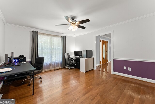 office space with ceiling fan, hardwood / wood-style flooring, ornamental molding, and baseboards